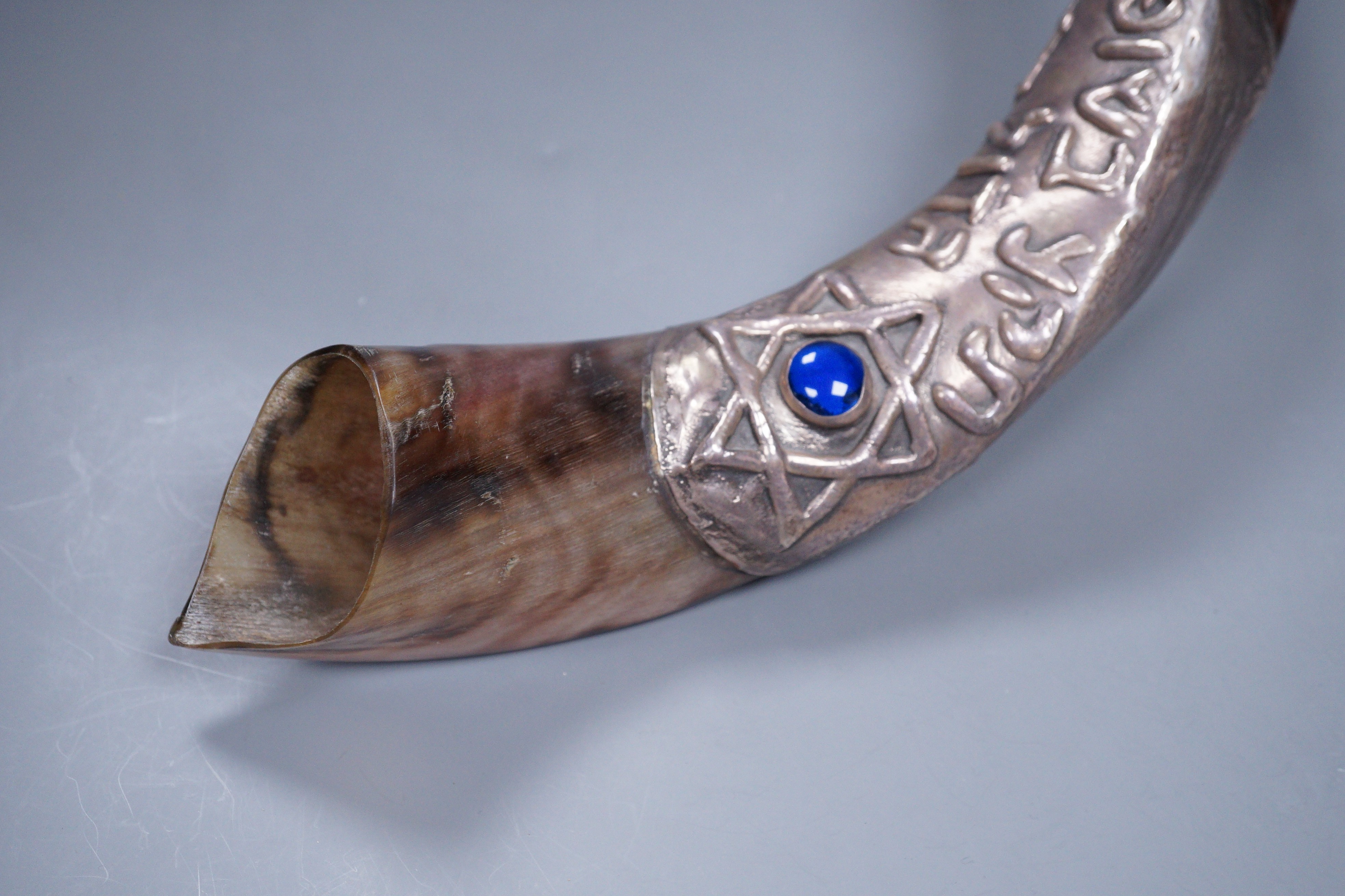 An Israeli white metal mounted horn shofar, stamped 925, 59cm